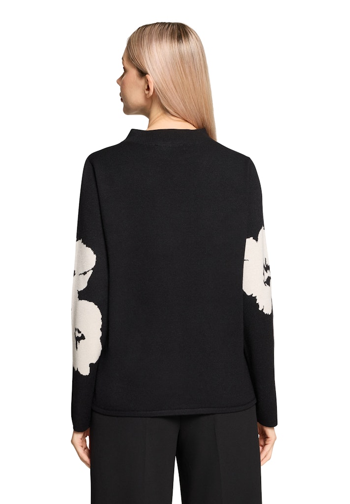 סריג גולף שחור עם הדפס פרחוני